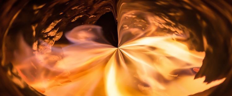 abstract fire vortex in hole with swirling flames